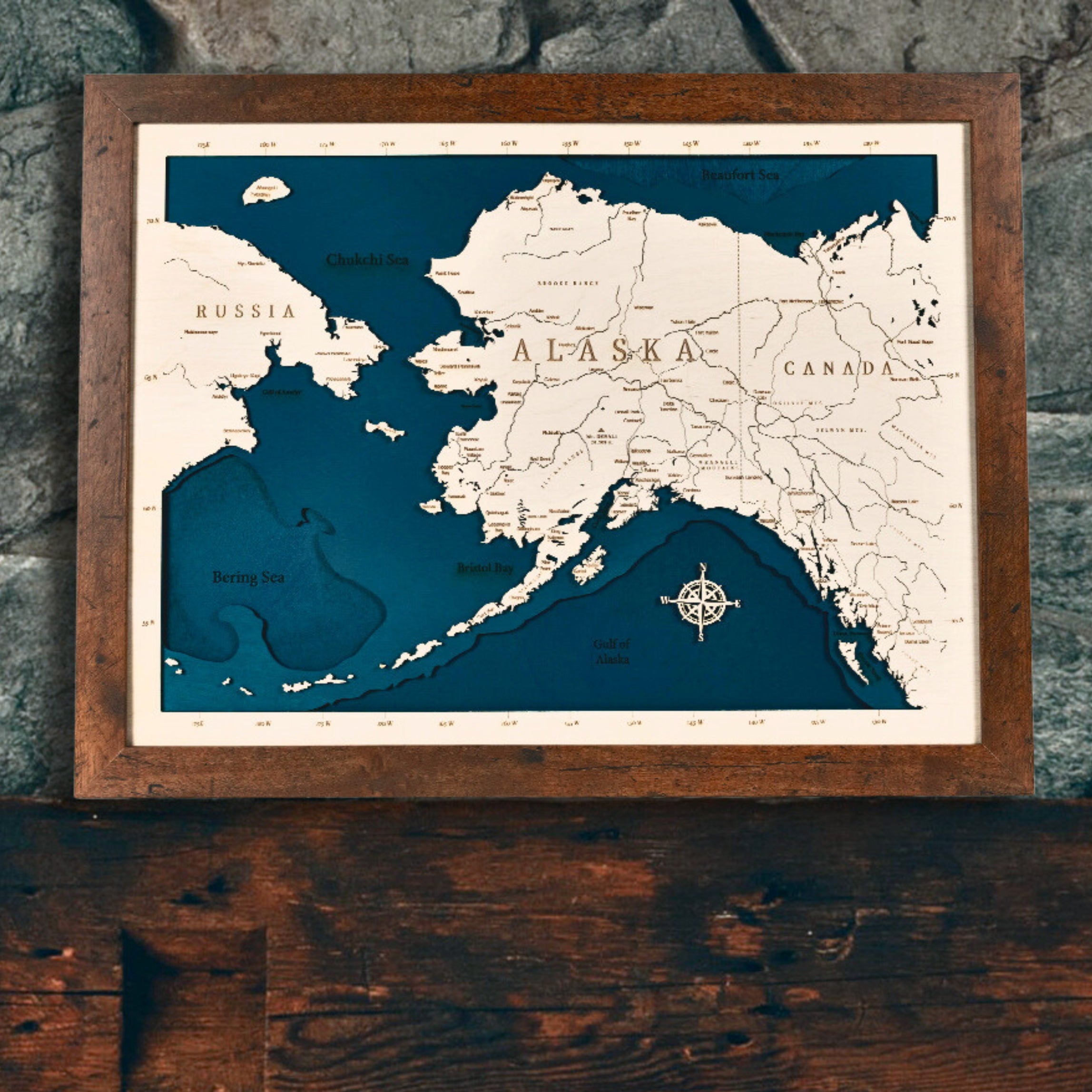 18x24 Laser Cut alaska state map with bathymetric ocean depths and highways and waterways engraved on the map.