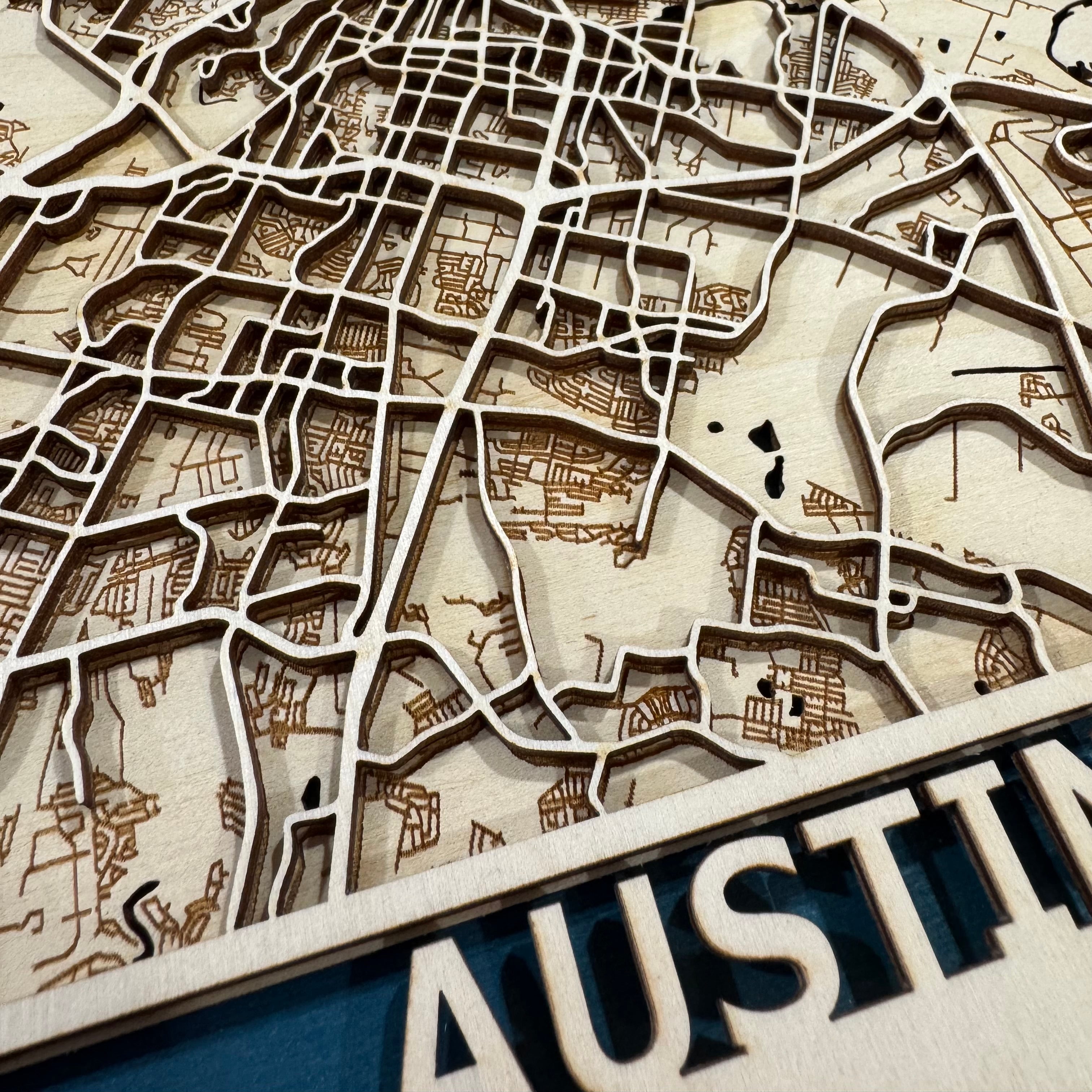 Close-up of intricate streets and waterways on our Austin TX wood map. This custom map makes a unique anniversary gift, wedding gift, or thoughtful housewarming present.
