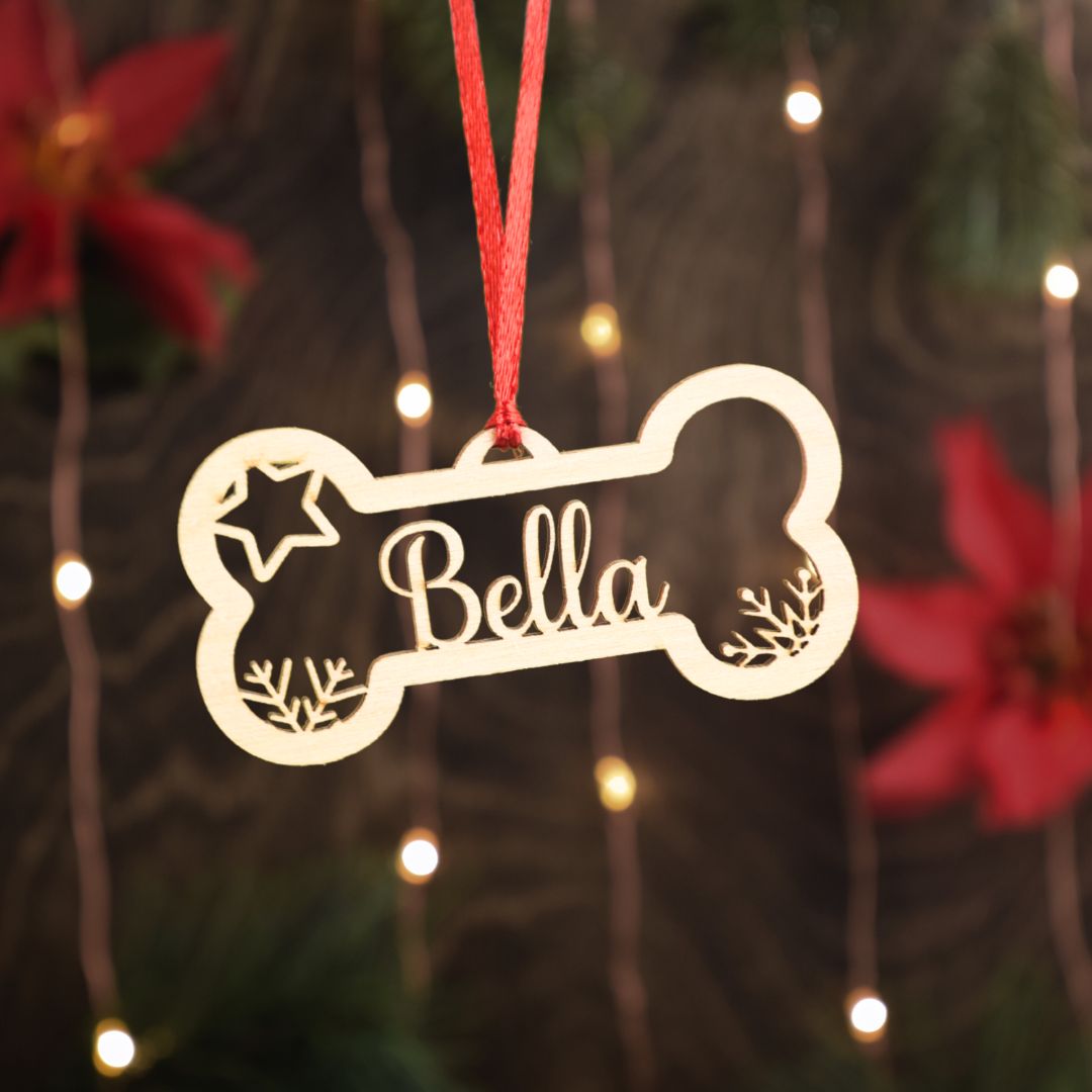 Dog Bone shaped christmas ornament with customization for a name and date. A great gift for dog owners, cat owners, pet, owners and dog walking businesses.