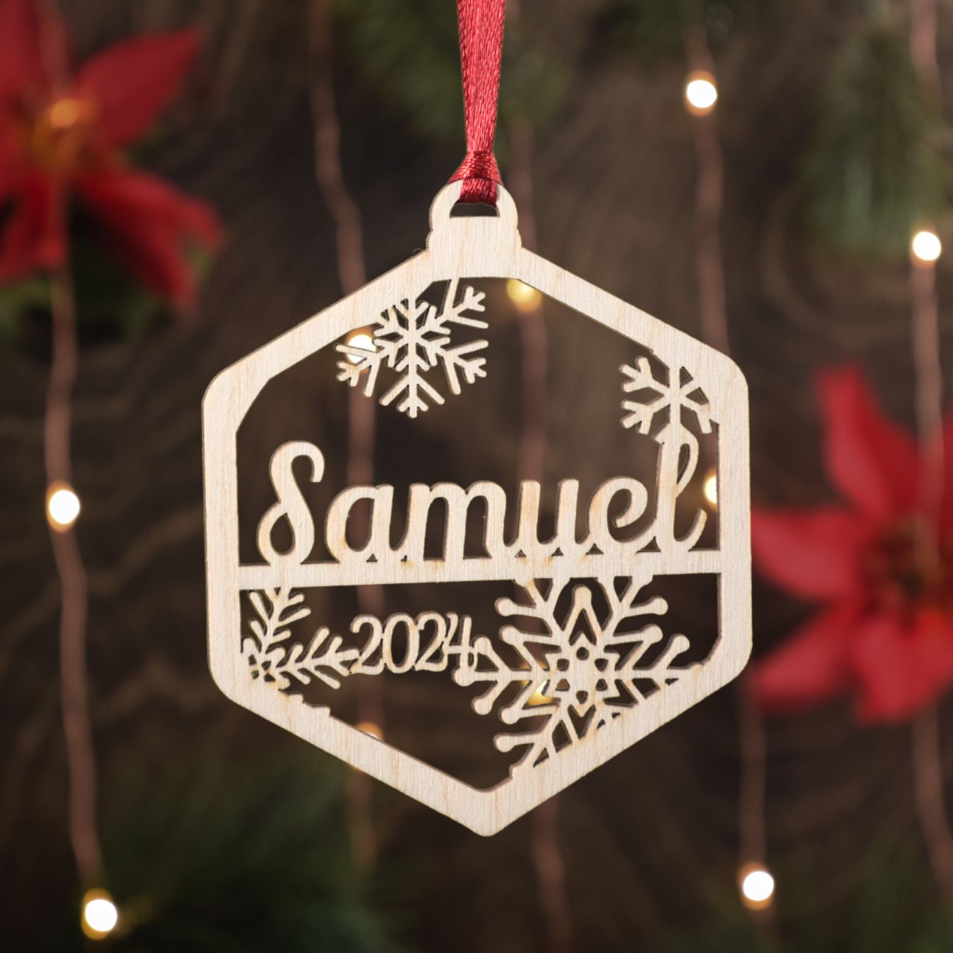 Personalized Christmas ornament laser cut in a hexagon shape.