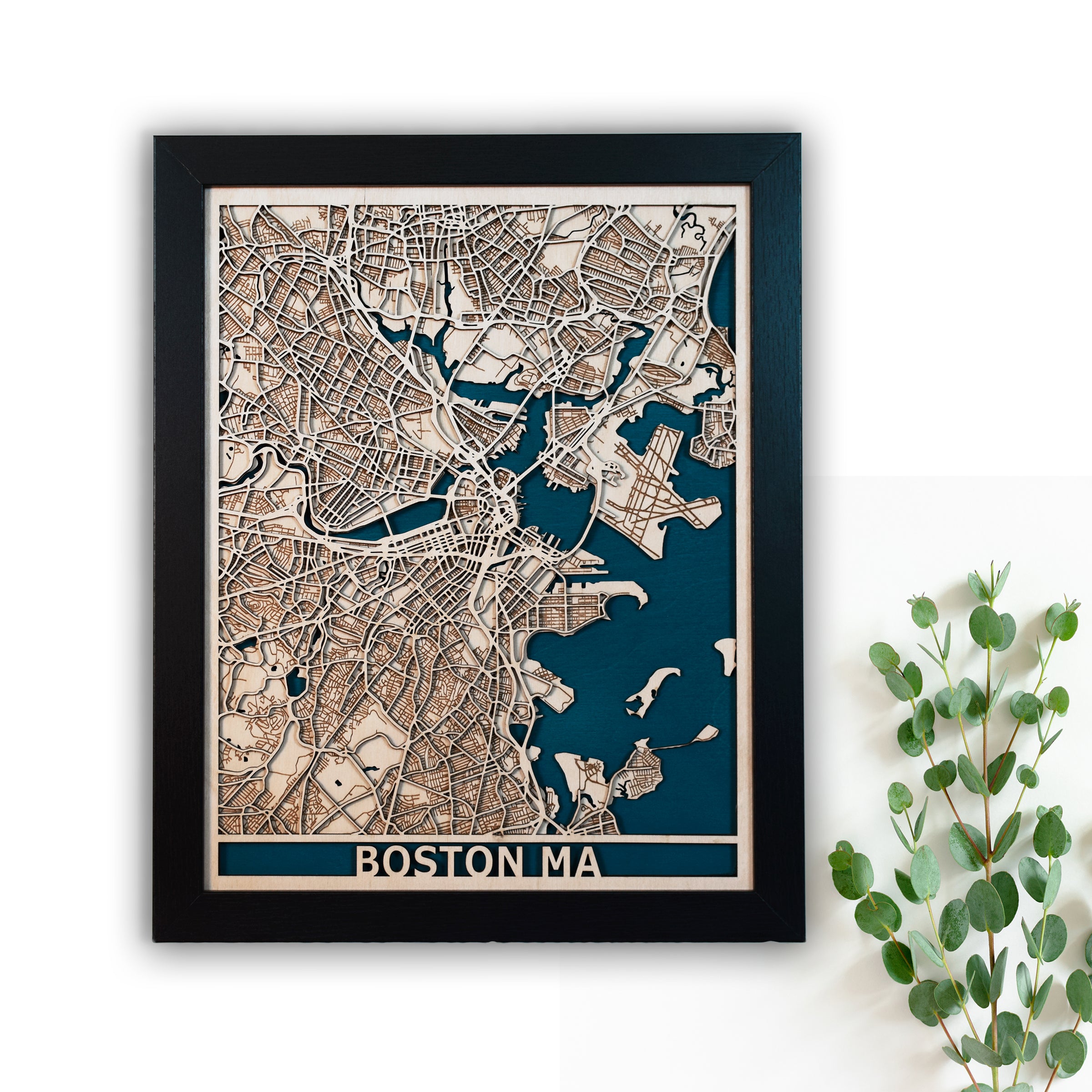 A 3D city street map of Boston MA.  Laser cut from premium baltic birch and highlighting the city streets and waterways. The map comes in multiple sizes.  