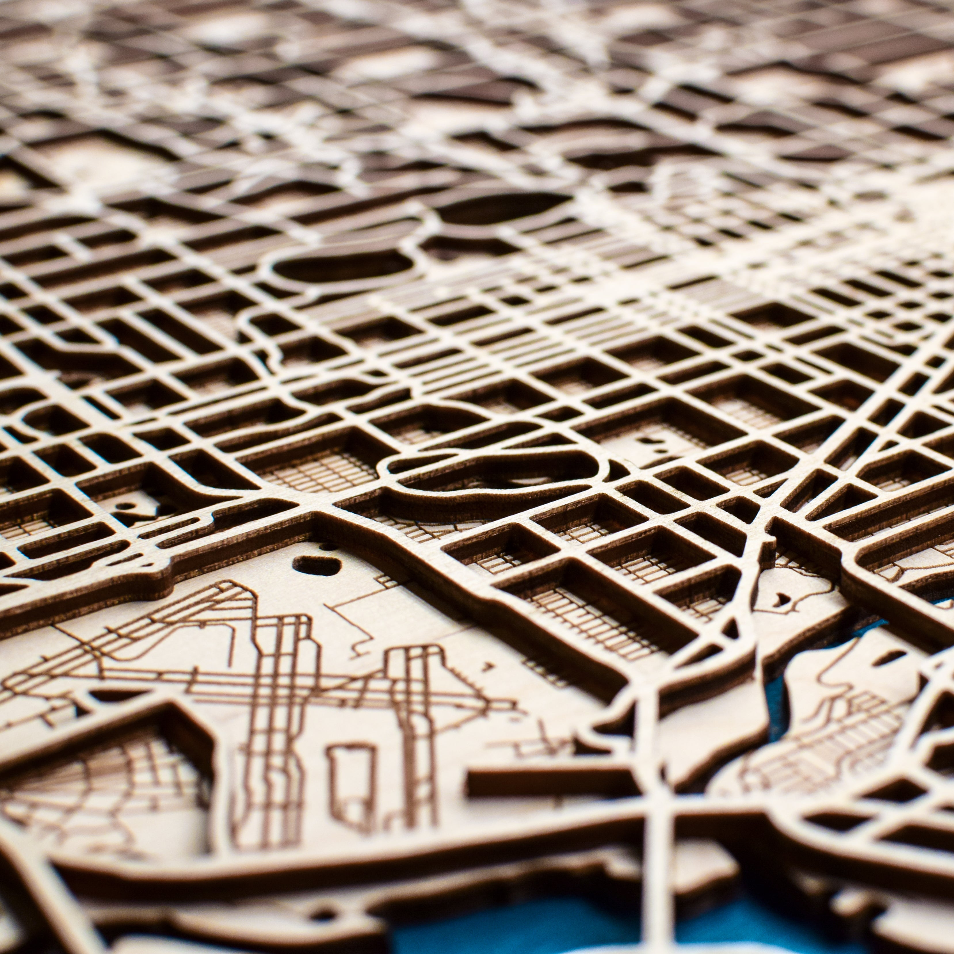 Intricate details of a laser cut city street map.